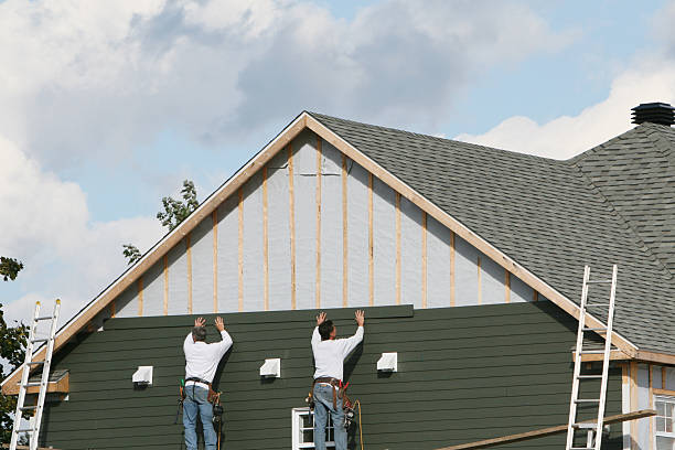 Professional Storm Damage Siding Repair technician working in Rushville, IL
